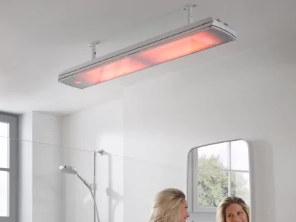 Heatscope Vision 3200W Radiant Heater elegantly wall-mounted in a contemporary indoor bathroom enhances comfort and energy efficiency for residential living.